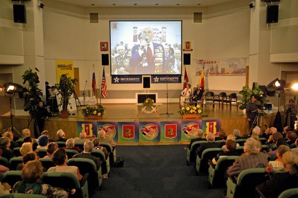 WWII veterans video conference — audience watching the live screen connection between surviving Normandie-Niemen airmen